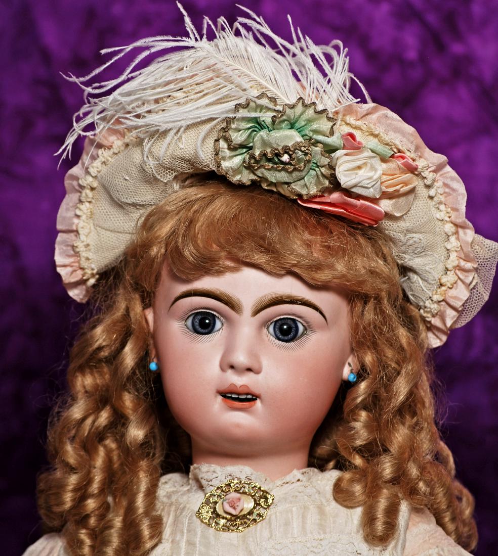 211. PRETTY FRENCH BISQUE BEBE BY JUMEAU. Marks: Tete: 211. PRETTY FRENCH BISQUE BEBE BY JUMEAU. Marks: Tete Jumeau (red stamp). 26". Bisque socket head, blue paperweight eyes, painted lashes, eyeliner, feathered and brushstroked brows, pierced ears, open