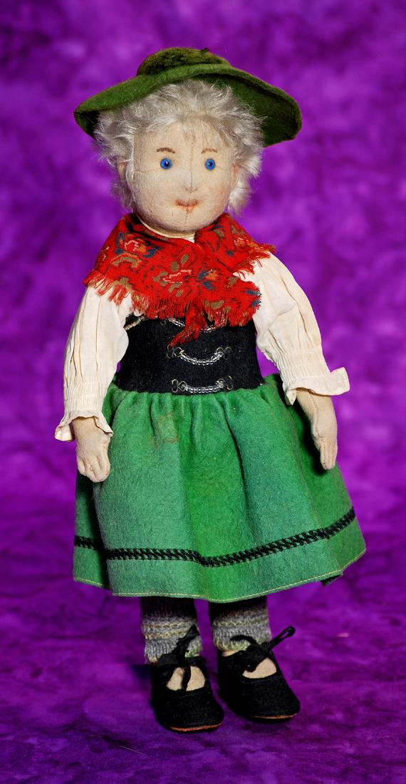 213. ALL-ORIGINAL STEIFF DOLL IN TRADITIONAL COSTUME OF: 213. ALL-ORIGINAL STEIFF DOLL IN TRADITIONAL COSTUME OF BAVARIA. Marks: Original button in ear. 11". Felt swivel head with center seam, pressed and painted features, blue glass eyes, pale blonde wispy