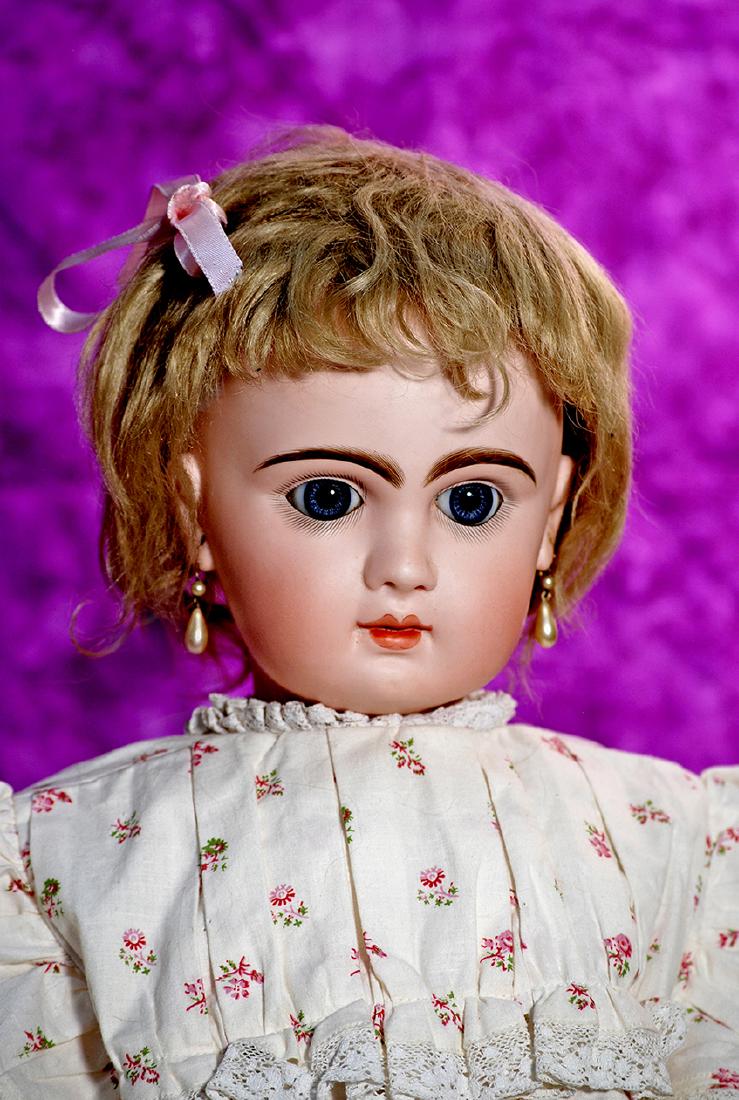 218, FRENCH BISQUE BLUE-EYED BEBE BY JUMEAU. Marks:: 218, FRENCH BISQUE BLUE-EYED BEBE BY JUMEAU. Marks: Depose Tete Jumeau 12 (red stamp). 26". Bisque socket head, blue paperweight eyes, painted lashes, eyeliner, feathered and brushstroked brows, pierc