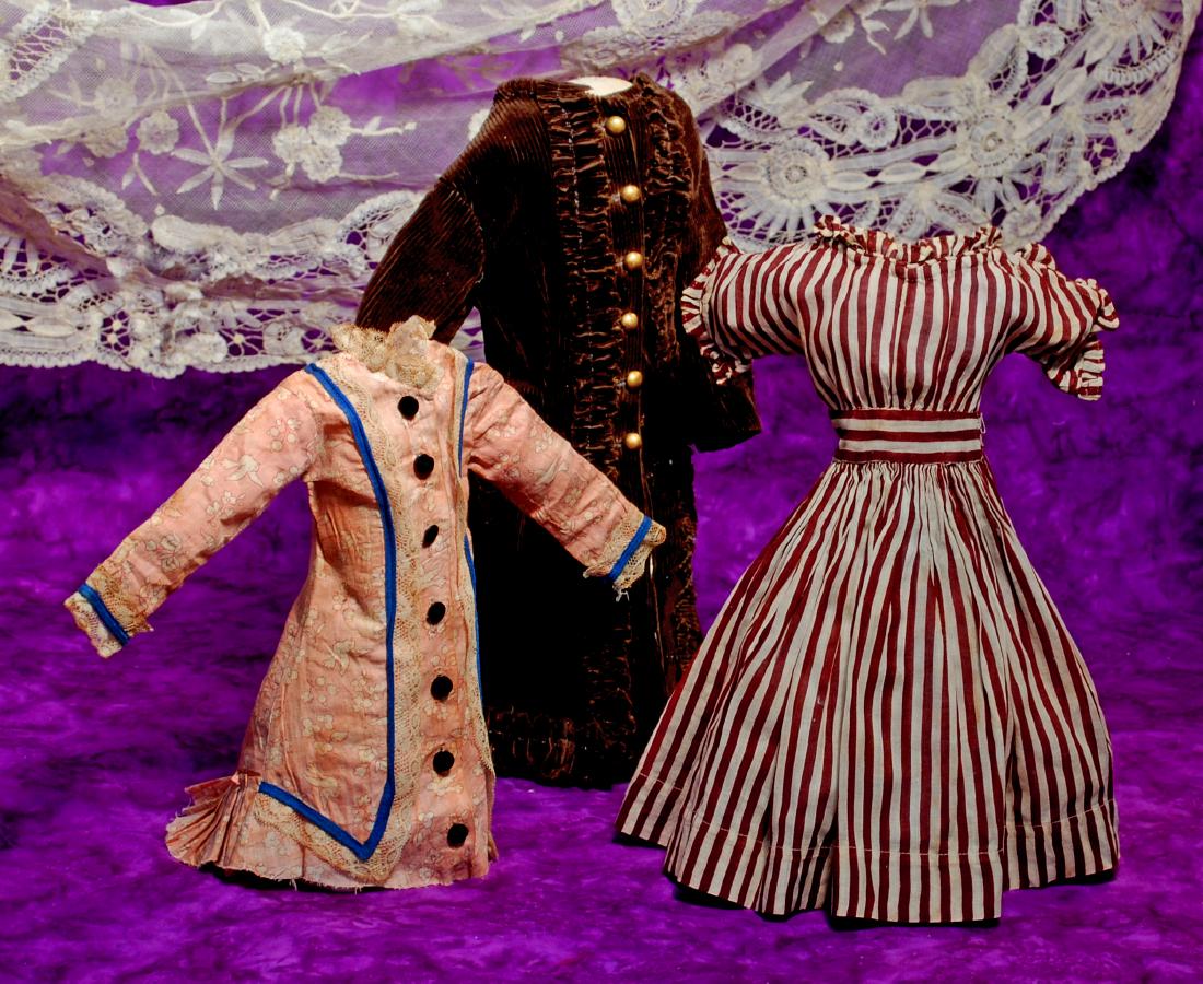 271. THREE ANTIQUE FASHION/LADY DRESSES. Princess-style: 271. THREE ANTIQUE FASHION/LADY DRESSES. Princess-style pink cotton print dress has inset long sleeves, shaped back with slightly-draped lower back pleated flounce, royal blue trim with lace edging, b