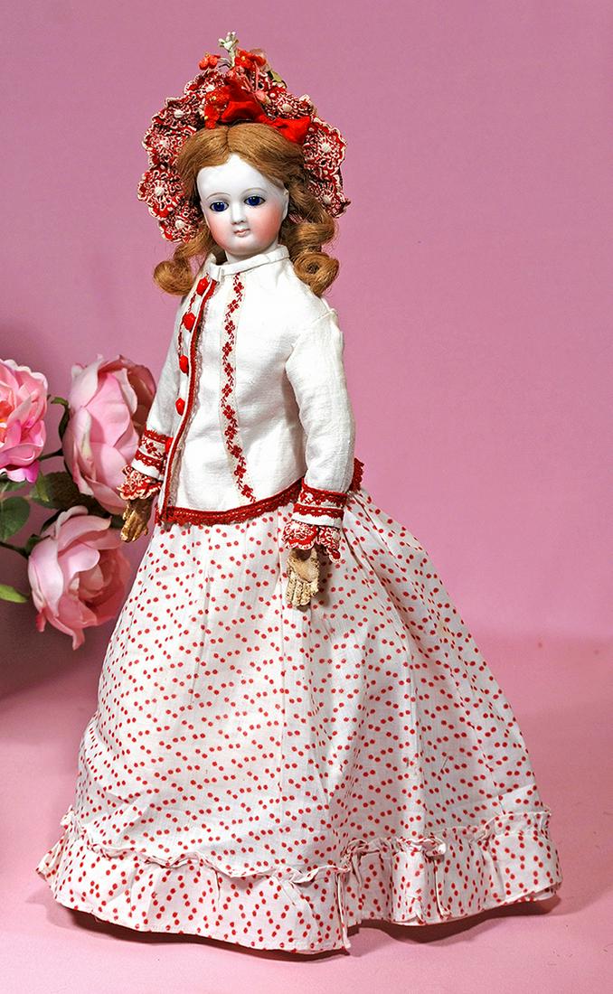 14. PRETTY FRENCH BISQUE POUPEE BY JUMEAU. Marks:: 14. PRETTY FRENCH BISQUE POUPEE BY JUMEAU. Marks: None. 15”. Bisque swivel head on bisque shoulderplate, inset cobalt blue glass eyes, painted lashes, feathered and widely-arched brows, closed mouth