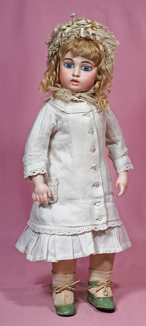 25. VERY BEAUTIFUL FRENCH BISQUE BEBE BRU CIRCLE DOT: 25. VERY BEAUTIFUL FRENCH BISQUE BEBE BRU CIRCLE DOT WITH SPLENDID EYES AND RARE PAINTED TEETH. Marks: Circle doll symbol, Bru Jne 6 (head); Bru Jne 6 (shoulderplate). 19”. Pressed bisque swivel hea