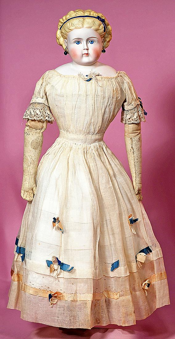 43. GERMAN BISQUE PARIAN LADY WITH BLUE HAIR RIBBON: 43. GERMAN BISQUE PARIAN LADY WITH BLUE HAIR RIBBON AND ORIGINAL COSTUME. Marks: None. 19”. Bisque shoulderhead with deeply-sculpted blonde hair waved away from face into ringlet curls which are sec
