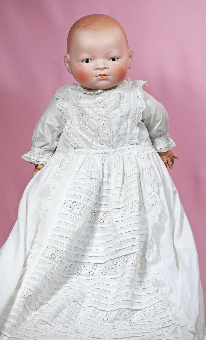 118. LIFE-SIZE GERMAN BISQUE “BYE-LO BABY” WITH BROWN: 118. LIFE-SIZE GERMAN BISQUE “BYE-LO BABY” WITH BROWN EYES. Marks: Corp. Grace S. Putnam/Germany. 17” head circumference. Solid-domed bisque socket head, painted brown hair, brown stationary gla