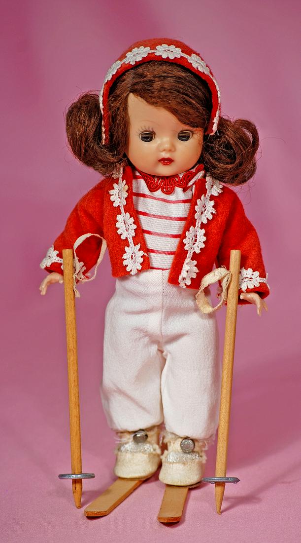 163. “MUFFIE IN SPECIAL OCCASION SKI COSTUME #808 - BY: 163. “MUFFIE IN SPECIAL OCCASION SKI COSTUME #808 - BY NANCY ANN STORYBOOK DOLLS. 8”. Hard plastic walker, blue sleep eyes, painted curly upper lashes and molded upper lashes, brown side-part wig,