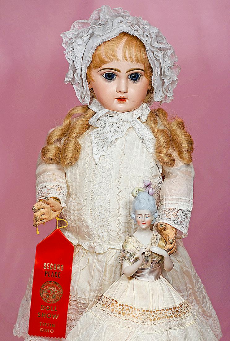 178. PRETTY BLUE-EYED FRENCH BISQUE BEBE BY JUMEAU.: 178. PRETTY BLUE-EYED FRENCH BISQUE BEBE BY JUMEAU. Marks: Tete Jumeau Depose 10. 22”. Bisque socket head, blue paperweight eyes, painted lashes, eyeliner, feathered and brushstroked brows, pierced 