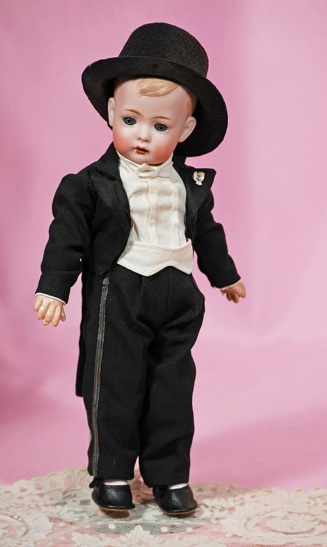 185. GERMAN BISQUE CHARACTER “TOMMY TUCKER” BY BRUNO: 185. GERMAN BISQUE CHARACTER “TOMMY TUCKER” BY BRUNO SCHMIDT. Marks: Heart Symbol, 2096-0. 12”. Solid dome bisque socket head, painted side-parted brown hair, blue sleep eyes, painted lashes, fe