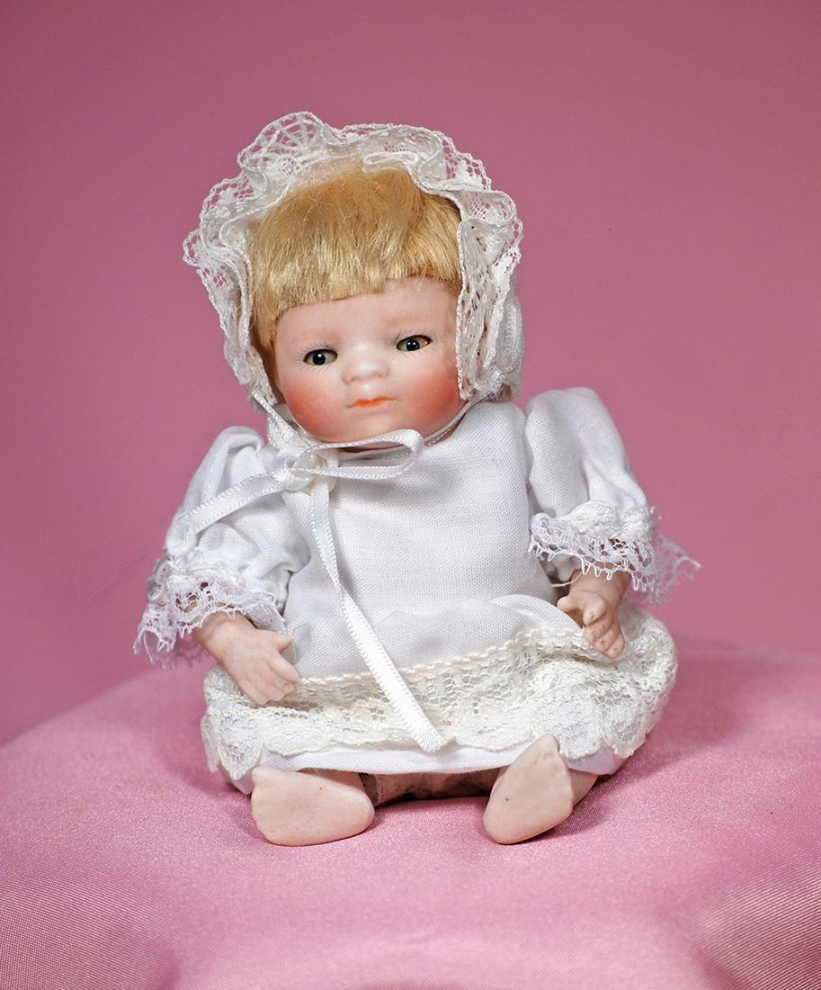 195. GERMAN ALL-BISQUE BYE-LO BABY WITH BROWN GLASS: 195. GERMAN ALL-BISQUE BYE-LO BABY WITH BROWN GLASS EYES. Marks: Copr. by Grace S. Putnam, Germany. 5”. All-bisque, jointed shoulders and hips, bent-limbs with bare feet, brown glass sleep eyes, pai