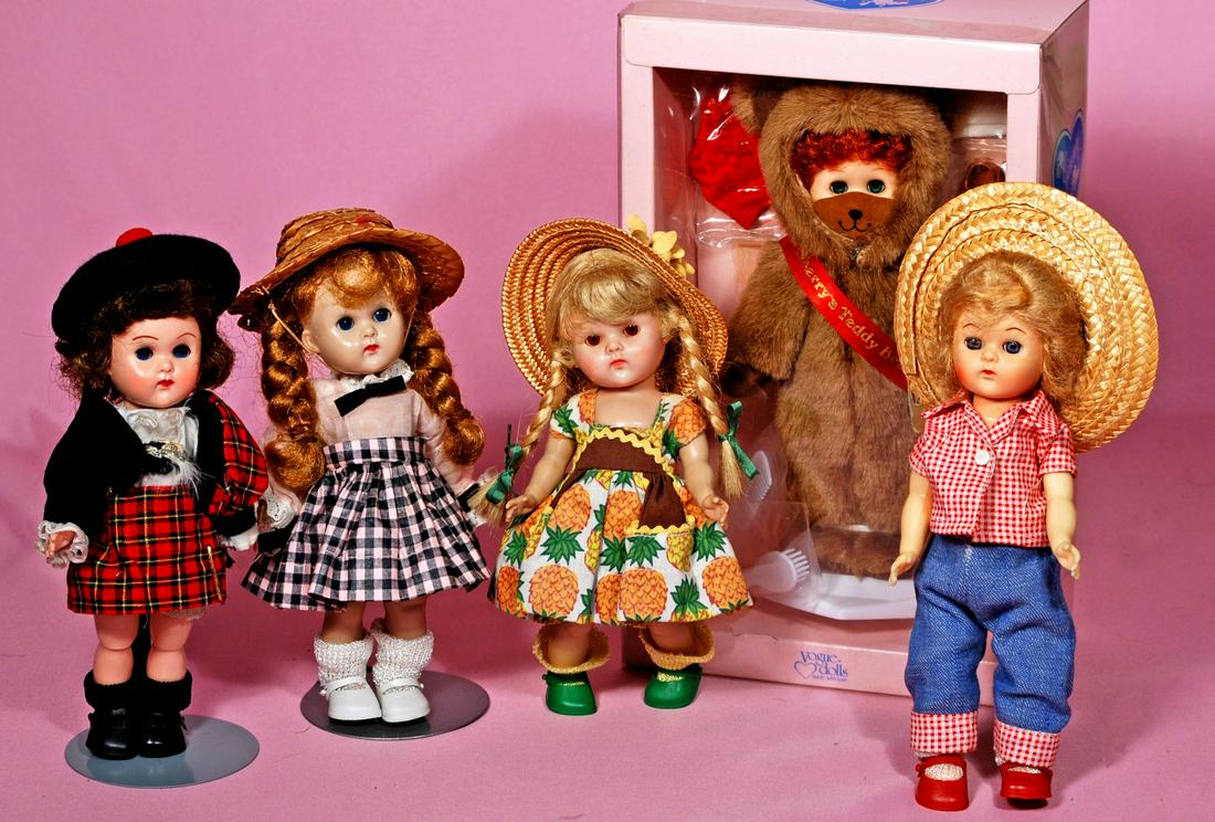 241. FIVE VOGUE GINNY DOLLS. Each is hard plastic,: 241. FIVE VOGUE GINNY DOLLS. Each is hard plastic, sleep eyes, one painted lashes, three molded lashes; Includes: Strung doll in tagged pineapple print dress and panty, straw hat, green vinyl shoes; S