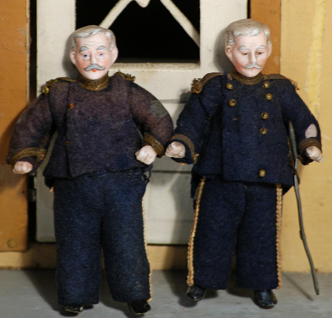 TWO ALLBISQUE MINIATURE DOLLHOUSE PORTRAITS OF ADMIRAL: TWO ALLBISQUE MINIATURE DOLLHOUSE PORTRAITS OF ADMIRAL DEWEY 3 1/2" Each is allbisque doll, jointed shoulders and hips, sculpted gray hair and mustache, painted features, black boots, dressed in origi