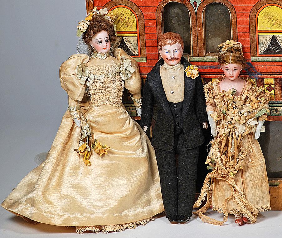 GERMAN BISQUE DOLLHOUSE DOLLS BRIDE, GROOM AND: GERMAN BISQUE DOLLHOUSE DOLLS BRIDE, GROOM AND BRIDESMAID 6" to 725" Each is bisque shoulderhead with muslin body and bisque lower limbs, painted shoes or boots; bride and bridesmaid have inset dark g