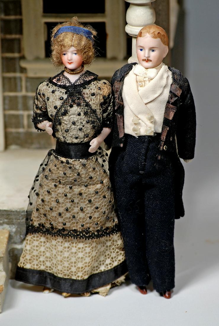 GERMAN BISQUE DOLLHOUSE LADY & GENTLEMAN 7" Each is: GERMAN BISQUE DOLLHOUSE LADY & GENTLEMAN 7" Each is bisque shoulderhead with painted features, muslin body with bisque lower arms and legs, painted shoes or boots; lady has original mohair wig with si