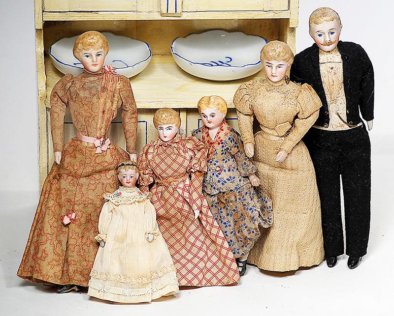 FAMILY OF SIX GERMAN BISQUE DOLLHOUSE DOLLS 3" to 7": FAMILY OF SIX GERMAN BISQUE DOLLHOUSE DOLLS 3" to 7" Each is bisque shoulderhead with sculpted hair and painted features, muslin body with bisque lower arms and legs, painted shoes or boots; dressed i