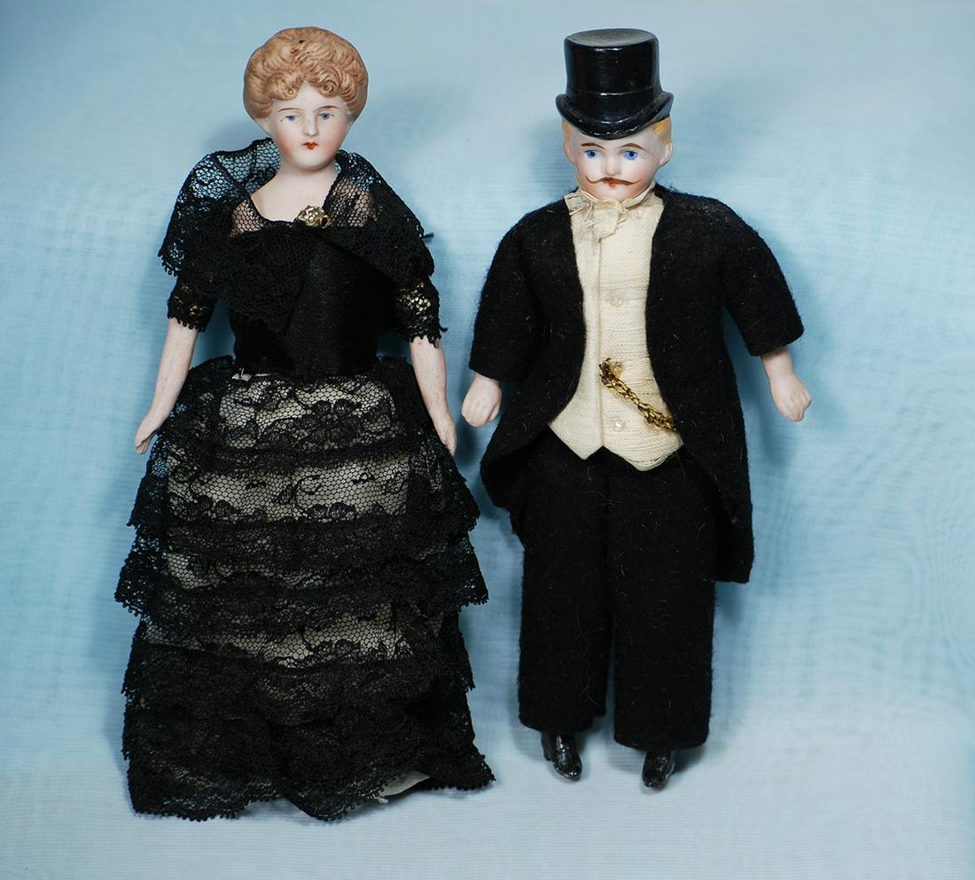 TWO GERMAN BISQUE DOLLHOUSE DOLLS INCLUDING MAN WITH: TWO GERMAN BISQUE DOLLHOUSE DOLLS INCLUDING MAN WITH SCULPTED TOP HAT 6" Each has bisque shoulderhead with sculpted hair, painted features, muslin body, bisque lower limbs, painted shoes or boots, gen