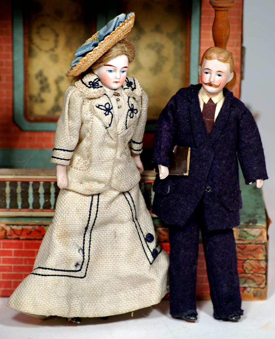 PAIR OF GERMAN BISQUE DOLLHOUSE DOLLS 6" Each is: PAIR OF GERMAN BISQUE DOLLHOUSE DOLLS 6" Each is bisque shoulderhead with painted features, muslin body, bisque lower arms and legs, painted black boots; gentleman with sculpted brown hair and moustac