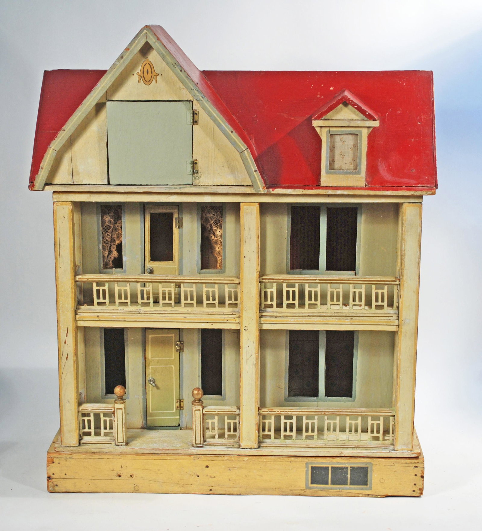 LARGE WOODEN DOLLHOUSE BY MORITZ GOTTSCHALK 27 ½: LARGE WOODEN DOLLHOUSE BY MORITZ GOTTSCHALK 27 1/2"H x 27"W x 20"D Wooden twostory house with attic, painted red roof, front porch and second floor balcony, painted hinged green doors at each level, o