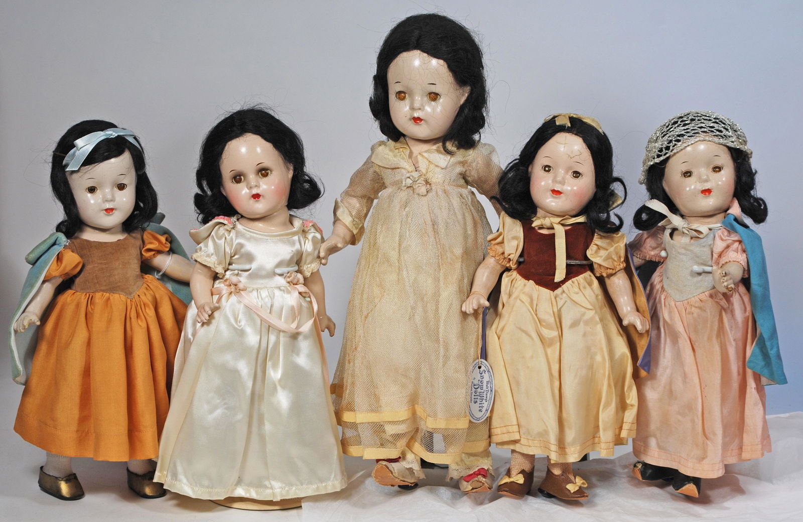 FIVE COMPOSITION "SNOW WHITE" DOLLS BY ALEXANDER 13": FIVE COMPOSITION "SNOW WHITE" DOLLS BY ALEXANDER 13" to 16" Each has composition socket head on fivepiece jointed body, black mohair wig, sleep eyes, closed mouth Two dolls are alloriginal and one has
