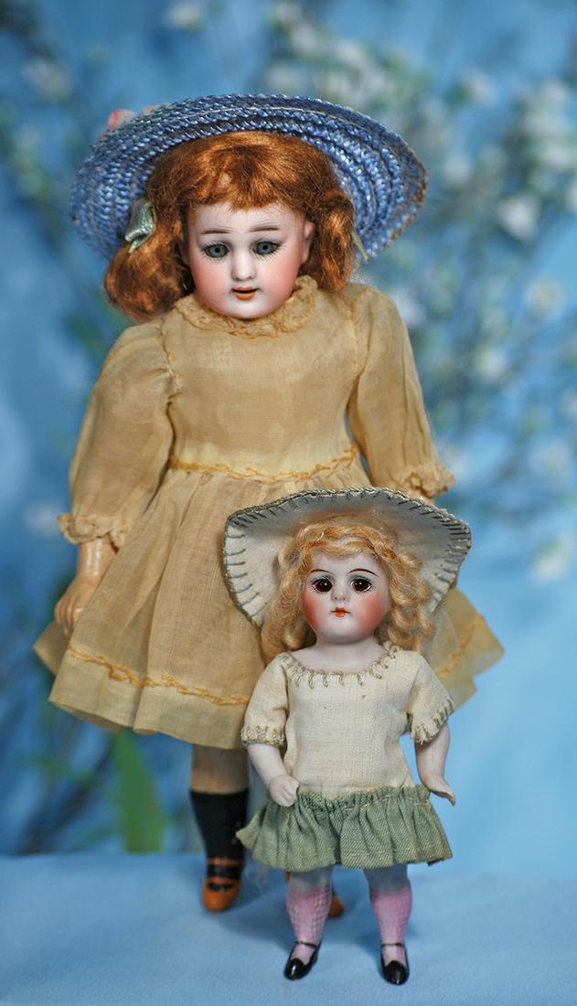 PETITE GERMAN BISQUE "GLOBE BABY" BY KARL HARTMANN.: PETITE GERMAN BISQUE "GLOBE BABY" BY KARL HARTMANN. Marks: Globe Baby, Hartmann, Germany. 8". Bisque socket head, blue sleep eyes, painted lashes, feathered brows, open mouth, upper teeth, auburn moha