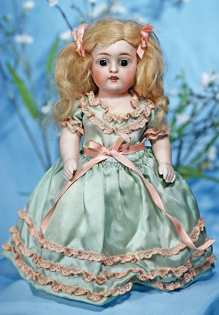 LARGE GERMAN ALL-BISQUE DOLL BY KESTNER. Marks: 150.4.: LARGE GERMAN ALL-BISQUE DOLL BY KESTNER. Marks: 150.4. 9". All-bisque, jointed at shoulders and hips, brown glass sleep eyes, painted lashes, feathered brows, open mouth, accented lips, upper teeth, o