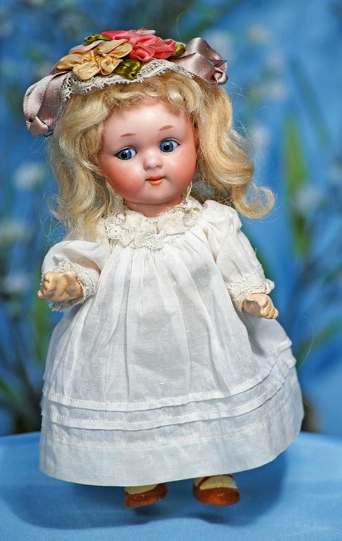 GERMAN BISQUE GOOGLY-EYED CHARACTER, 200, BY MARSEILLE.: GERMAN BISQUE GOOGLY-EYED CHARACTER, 200, BY MARSEILLE. Marks: 200, A 10/0 M. DRGM 243. 6 ½". Bisque socket head, stationary blue glass side-glancing eyes, painted lashes, dash-type brows, button nos