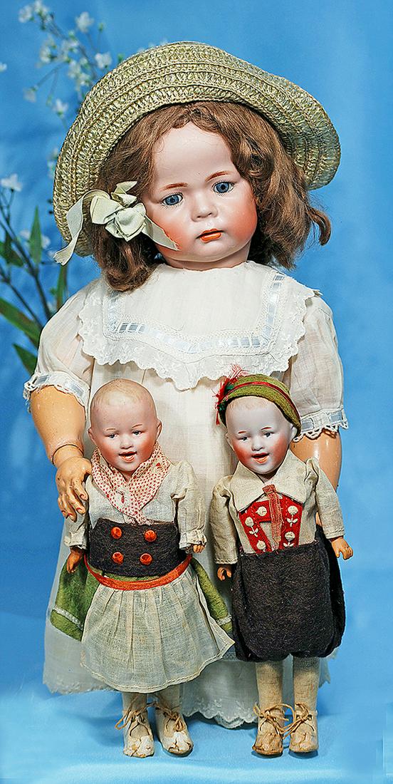 PAIR OF ALL-ORIGINAL GEBRUDER HEUBACH NOVELTY DOLLS.: PAIR OF ALL-ORIGINAL GEBRUDER HEUBACH NOVELTY DOLLS. Marks: Germany HH 5/0. 9". Each is bisque shoulderhead with sculpted blonde hair, painted features, blue intaglio eyes, tapered brows, mouth modele
