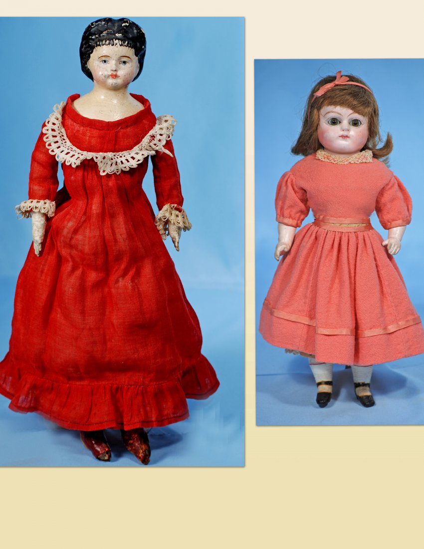 TWO PAPIER MACHE DOLLS: 253. TWO DOLLS: GERMAN PAPIER MACHE LADY WITH BANGS & PAPIER MACHE DOLL WITH GLASS EYES. (1) Lady with bangs, marked: America, muslin-lined No. (partial shoulder back label). 16”. Papier mache shoul