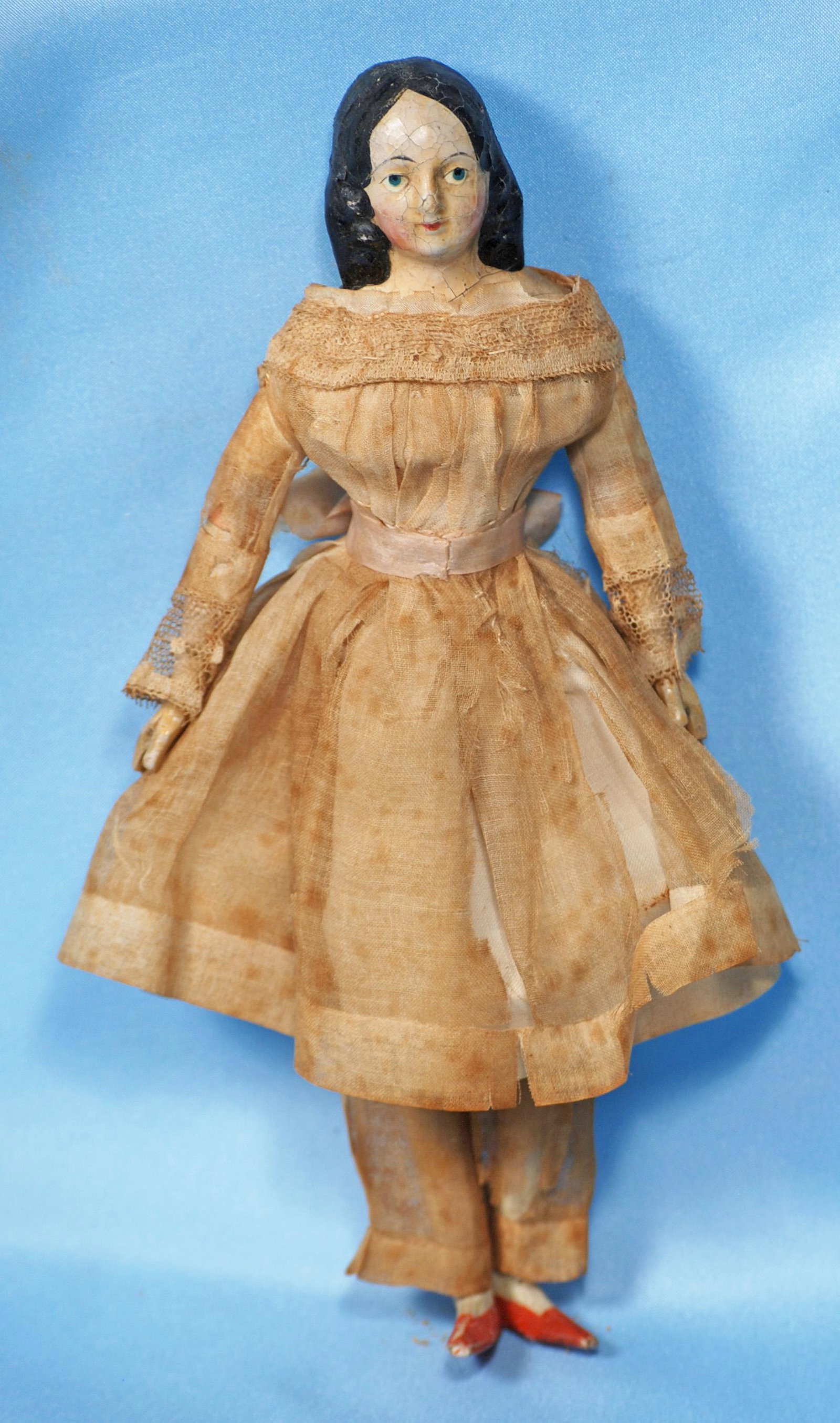 PETITE GERMAN PAPIER MACHE MILLINER MODEL WITH LONG: PETITE GERMAN PAPIER MACHE MILLINER MODEL WITH LONG CURLS AND CHIGNON. 8". Papier mache shoulderhead with oval face, black hair with long curls at the sides and coiled braid chignon at the back, paint