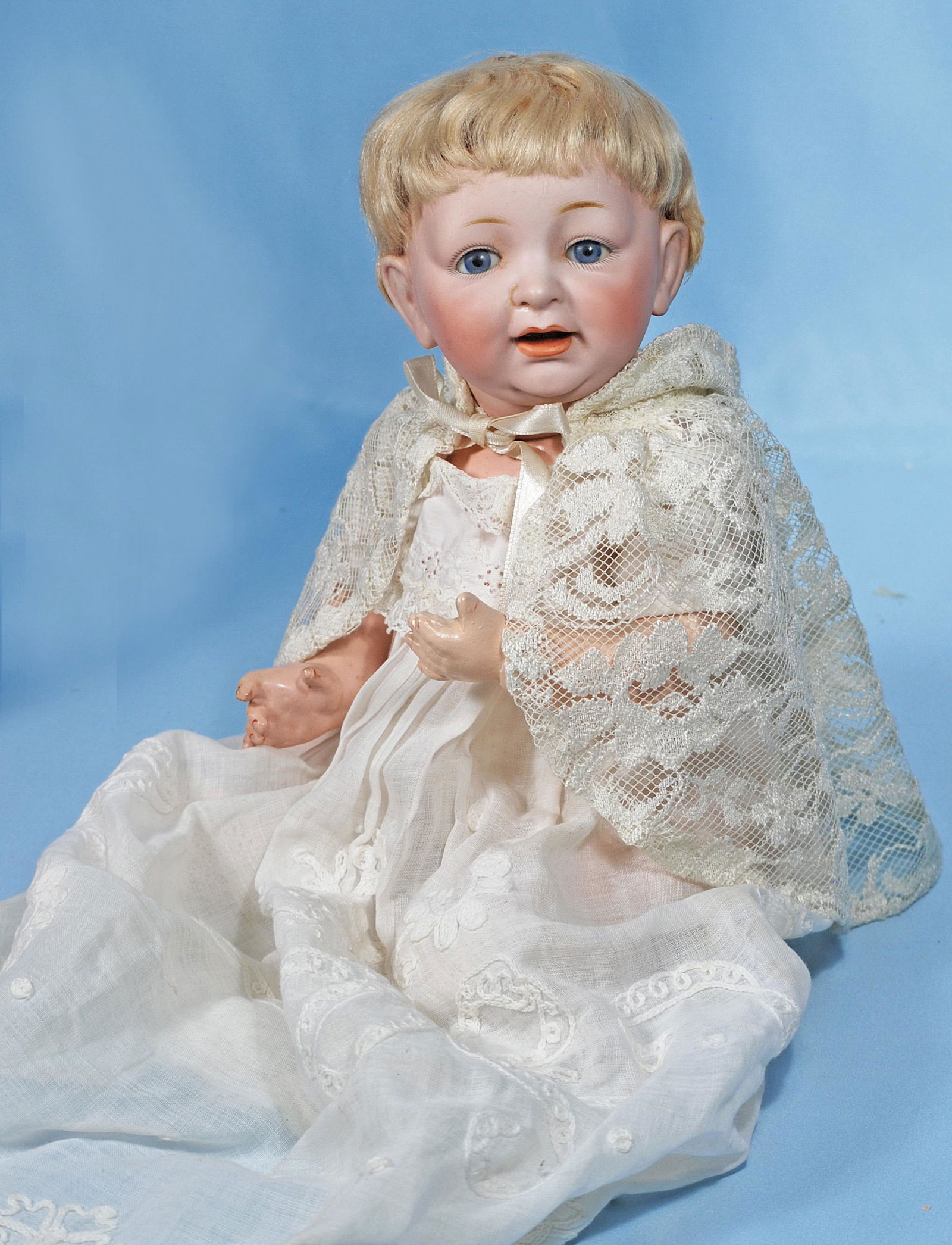GERMAN BISQUE CHARACTER BABY BY KESTNER. Marks: JDK: GERMAN BISQUE CHARACTER BABY BY KESTNER. Marks: JDK 211. 14". Bisque socket head, blue sleep eyes, painted lashes, feathered brows, open mouth, accented lips, two lower teeth, original blonde mohair w