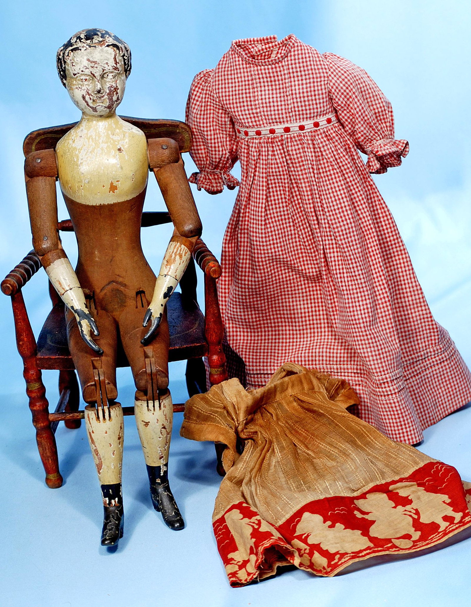 EARLY AMERICAN WOODEN DOLL BY JOEL ELLIS. 15". Carved: EARLY AMERICAN WOODEN DOLL BY JOEL ELLIS. 15". Carved wooden doll with gesso-over-wood painted head and shoulders, all-dowel-jointed wooden body with pewter hands and feet, includes two antique cotton