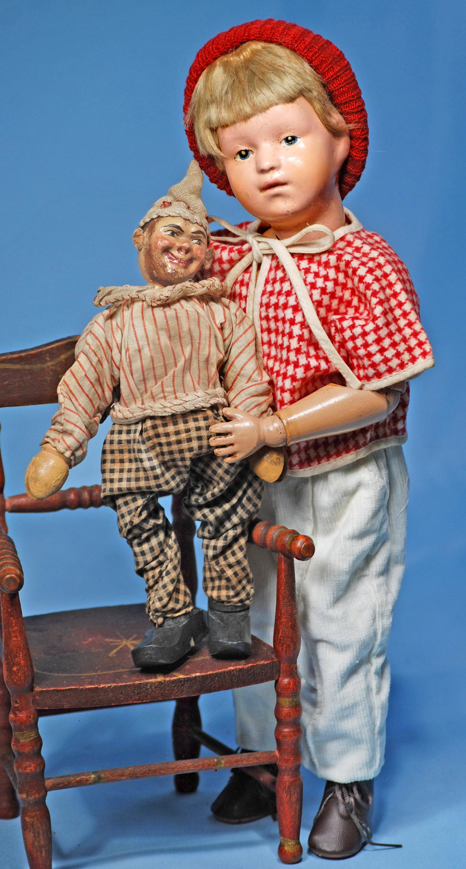 CARVED WOODEN CHARACTER WITH CIRCUS CLOWN BY SCHOENHUT.: CARVED WOODEN CHARACTER WITH CIRCUS CLOWN BY SCHOENHUT. Schoenhut patent label on back.. 15". Carved wooden socket head, painted blue intaglio eyes, closed mouth, shaded lips, original blonde nailed-o