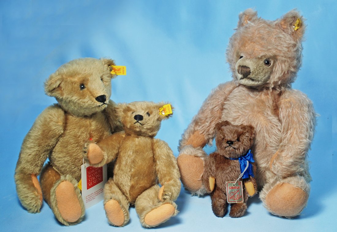 THREE STEIFF TEDDY BEARS & TINY GRISLY BEAR.: 324. THREE STEIFF TEDDY BEARS & TINY GRISLY BEAR. 9” and 14” Steiff Strong Museum replica bears; 15” Steiff 1950’s Zotty Bear; 7” brown mohair bear, tagged Grisly. Zotty bear has moderate we