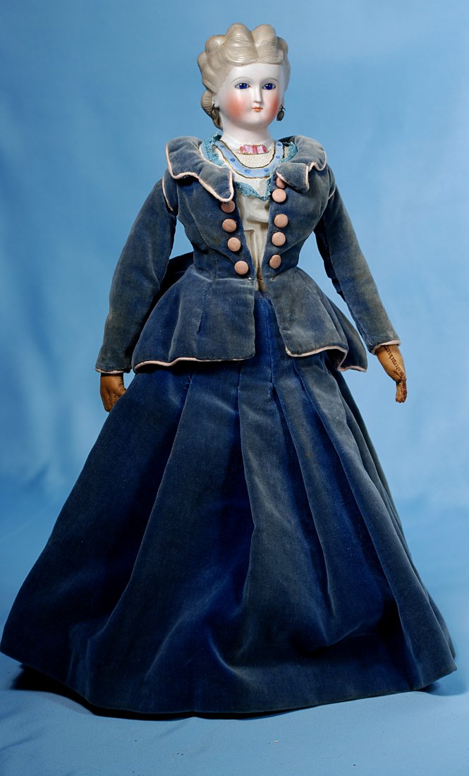 GERMAN BISQUE PARIAN LADY WITH GLASS EYES AND FANCY BOD: 329. GERMAN BISQUE PARIAN LADY WITH GLASS EYES AND FANCY BODICE. 16 ½”. Bisque shoulderhead with blonde sculpted hair in upswept arrangement, cobalt blue glass eyes, painted lashes and brows, close