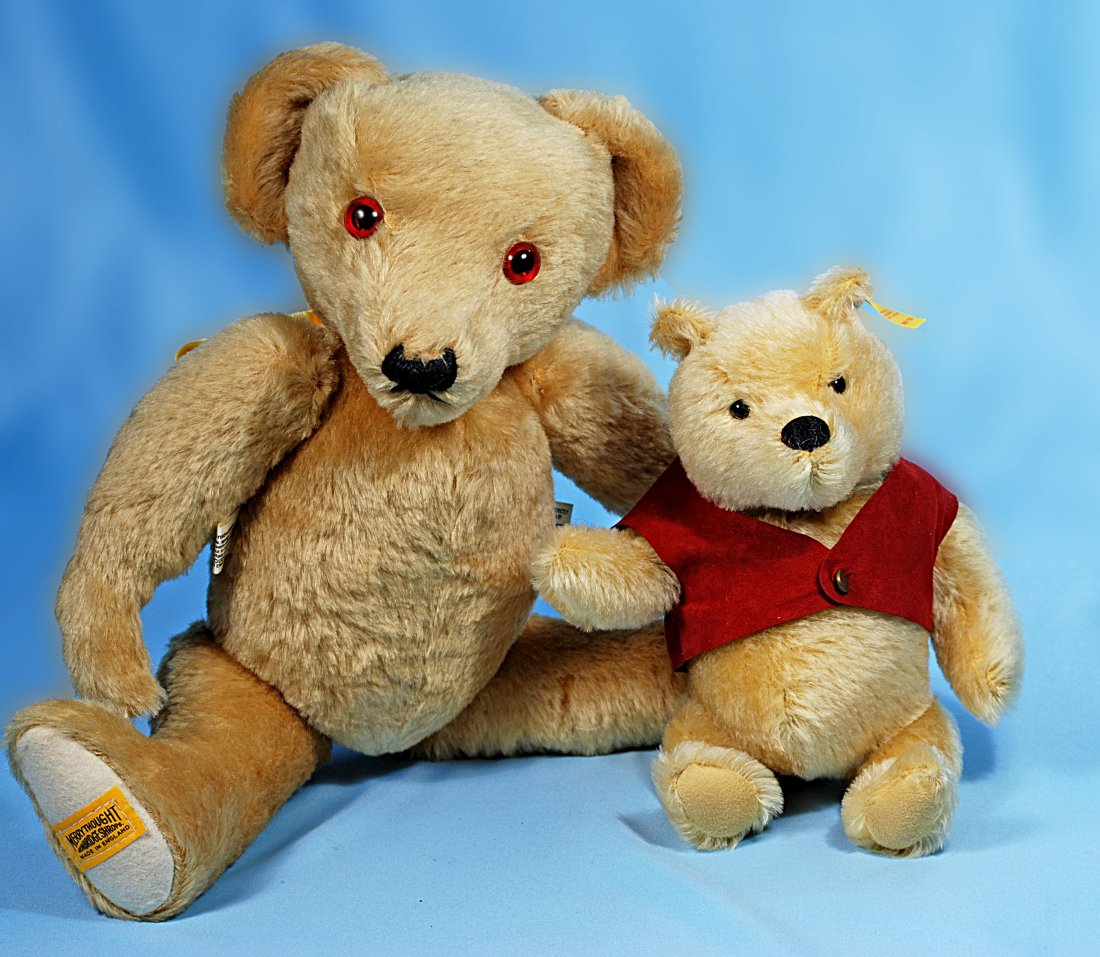 STEIFF LTD. EDITION WINNIE THE POOH BEAR & MERRYTHOUGH: 312-A. STEIFF LTD. EDITION WINNIE THE POOH BEAR & MERRYTHOUGHT BEAR. 11” golden mohair Pooh has swivel head, jointed body, red jacket, Steiff ear button and tag; 16” champagne mohair Merrythought 