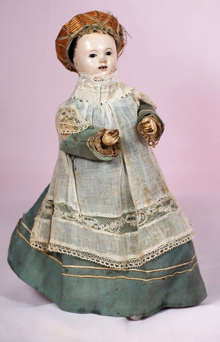 FRENCH PAPER MACHE MECHANICAL BY THERODE: 30-A. ALL-ORIGINAL FRENCH PAPER MACHE MECHANICAL "CHILD WITH BOURRELET CAP" BY THERODE. 11". Paper mache head with tiny black eyes, painted lashes and brows, open mouth, outlined lips, tiny teeth, bla