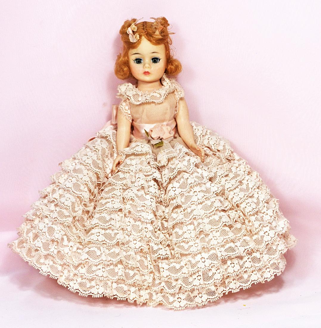ALEXANDER CISSETTE PORTRETTE AS "MELANIE": ALEXANDER CISSETTE PORTRETTE AS "MELANIE". 10". All hard plastic, socket head, adult modeled body, reddish-blonde hair with curls at sides of forehead and long curls at sides and back of head. Wears t