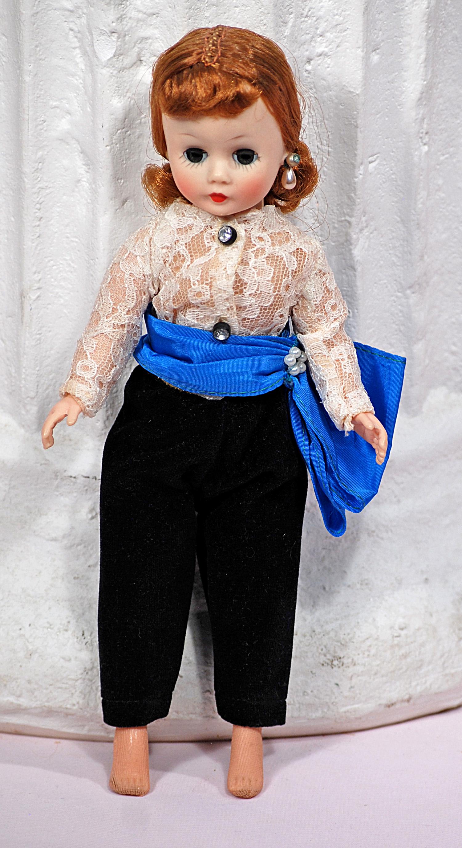 ALEXANDER CISSETTE IN BLACK TOREADOR PANTS: ALEXANDER CISSETTE IN BLACK TOREADOR PANTS. 10". Hard plastic doll with adult modeled body and jointed knees, sleep eyes, closed mouth auburn hair drawn from face and captured in curls at nape of neck