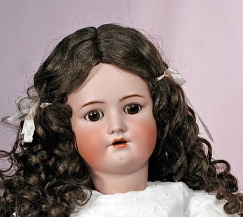 LARGE GERMAN BISQUE CHILD BY HANDWERCK: LARGE GERMAN BISQUE CHILD BY HANDWERCK. 32". Marks: Heinrich Handwerck, Simon & Halbig, Germany. 32Â”. Bisque socket head, brown sleep eyes, painted lashes, feathered brows, pierced ears, open mout