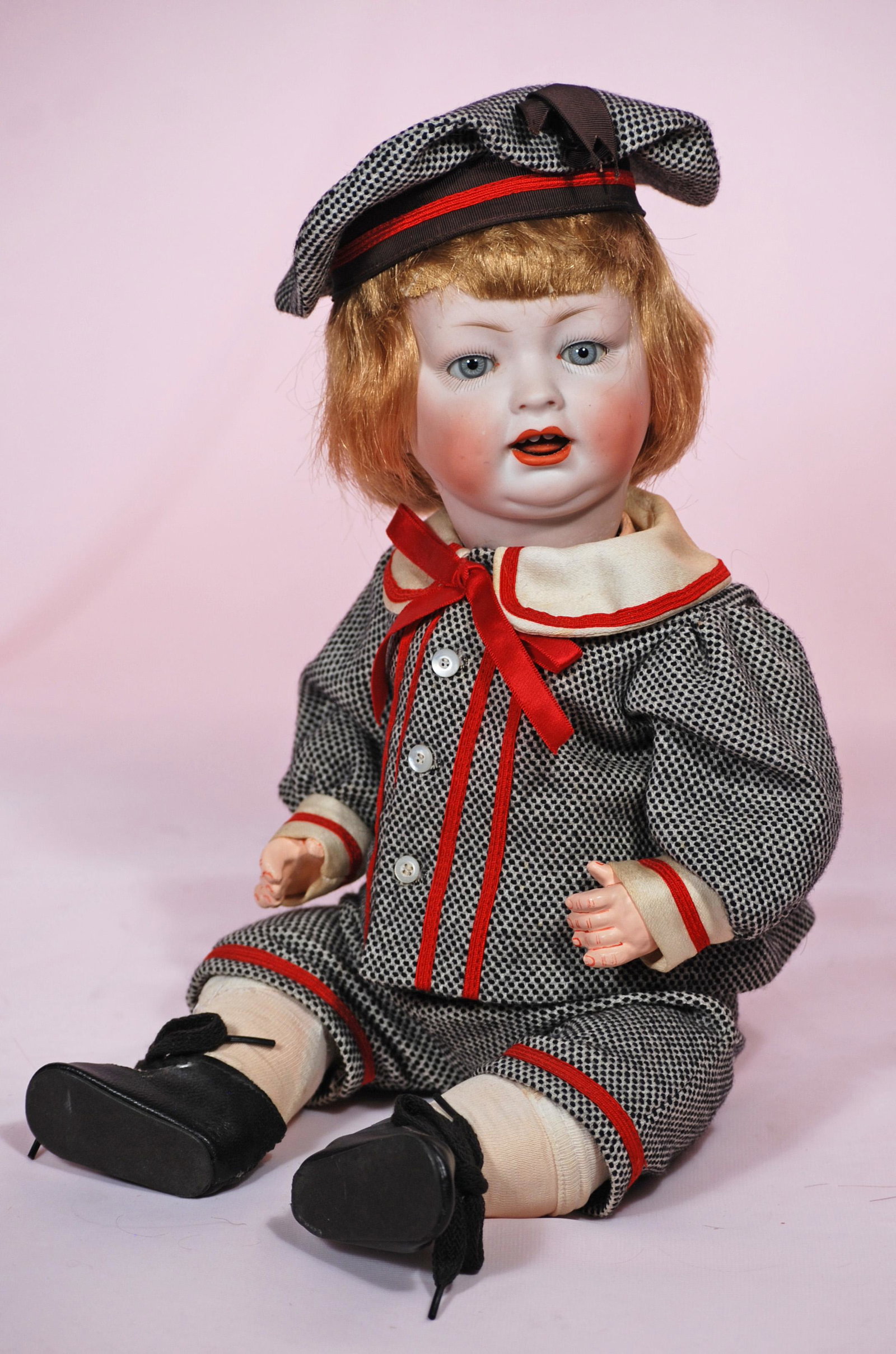 GERMAN BISQUE CHARACTER BABY BY LOIS WOLF: GERMAN BISQUE CHARACTER BABY BY LOIS WOLF. 16". Marks: L.W.C. Bisque socket head, blue sleep eyes, painted lashes, wavy brows, open mouth, upper teeth reddish-blonde synthetic wig, composition baby bo