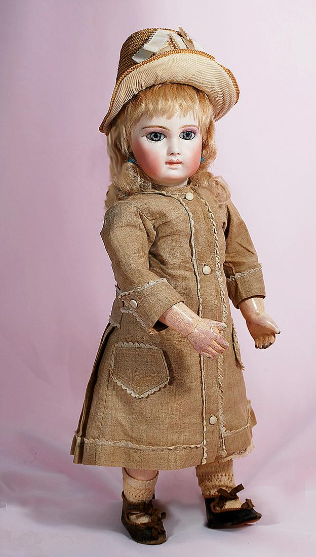 SUPERB EARLY MODEL PREMIERE BEBE BY EMILE JUMEAU: SUPERB EARLY MODEL PREMIERE BEBE BY EMILE JUMEAU. Marks: None. 16”. Pressed bisque socket head, almond-shaped blue paperweight eyes with spiral threading, eyeliner, painted lashes, mauve-blushed eye