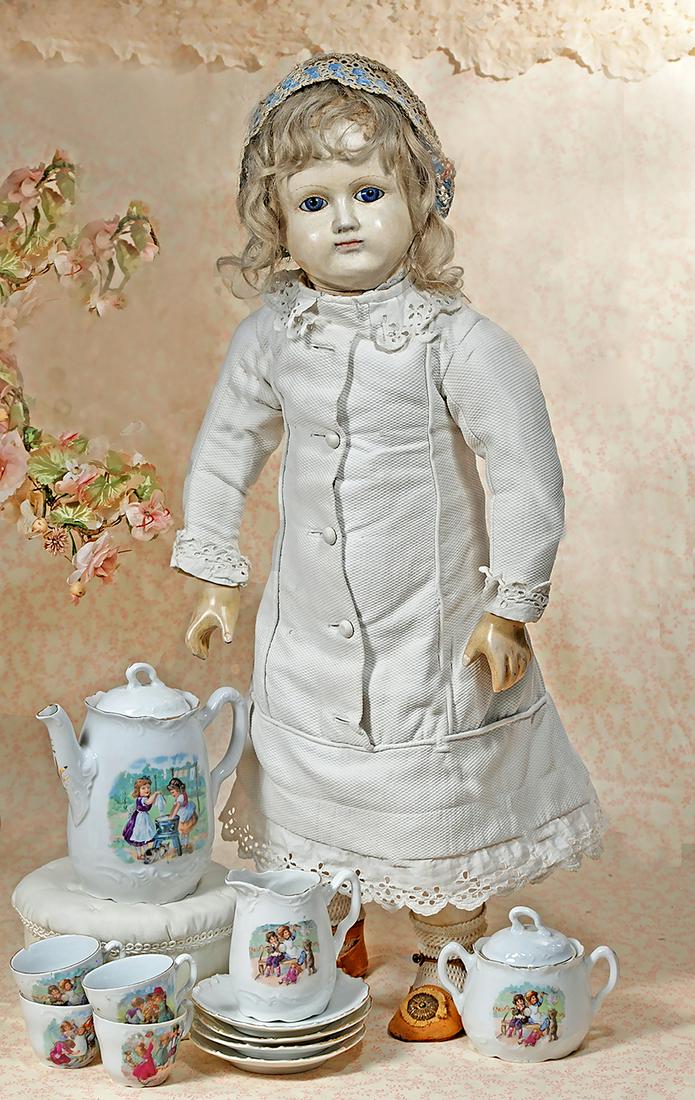 GERMAN PORCELAIN TEA SET WITH SCENES OF CHILDHOOD: GERMAN PORCELAIN TEA SET WITH SCENES OF CHILDHOOD. White porcelain tea service with gilt edging is decorated with various, colorful scenes of children at play. Comprised of lidded teapot, creamer, lid