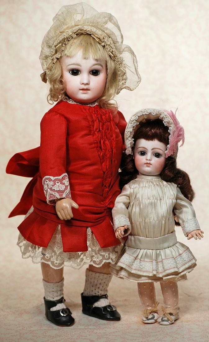 FRENCH BISQUE EARLY PREMIERE BEBE BY EMILE JUMEAU: FRENCH BISQUE EARLY PREMIERE BEBE BY EMILE JUMEAU. 13 ½”. Marks: 4. Bisque socket head, large brown paperweight eyes, dark eyeliner, painted lashes, feathered and arched brows, closed mouth