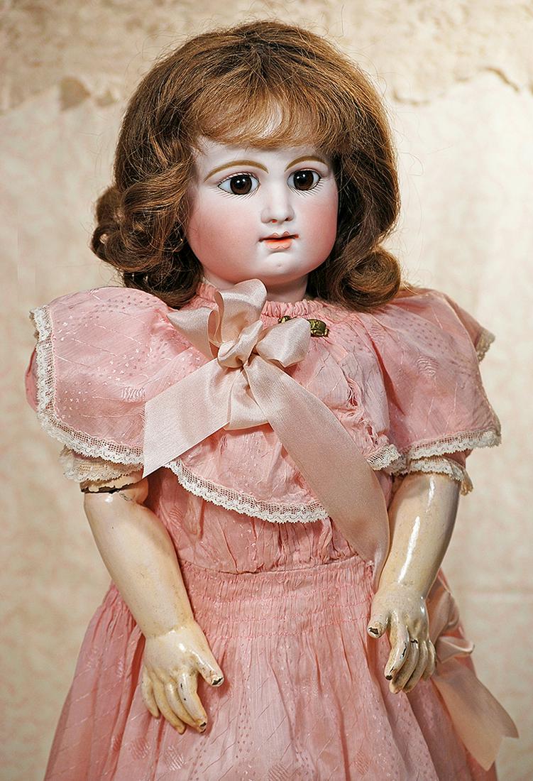 FRENCH BISQUE BEBE BY RABERY DELPHIEU: FRENCH BISQUE BEBE BY RABERY DELPHIEU. 23". Marks: R. 3 D. Bisque socket head, large brown paperweight eyes, painted lashes, eyeliner, lightly rose-blushed eyelids, feathered and brushstroked brows, c