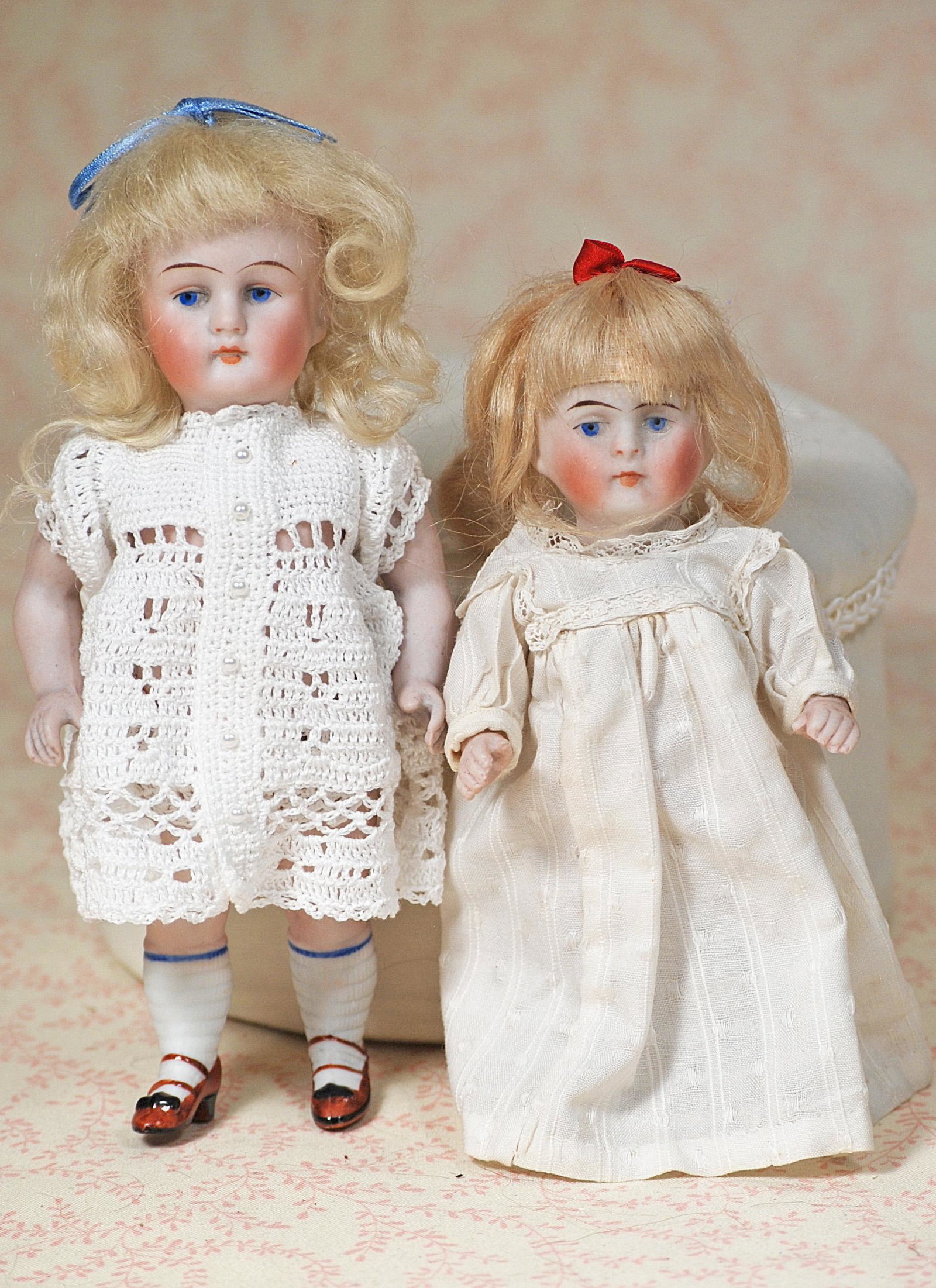 TWO GERMAN ALL-BISQUE DOLLS: TWO GERMAN ALL-BISQUE DOLLS. 6” DOLL 6” doll marked 130, painted features, blue eyes, closed mouth, blonde mohair wig, jointed shoulders and hips, painted socks and brown heeled shoes, cro