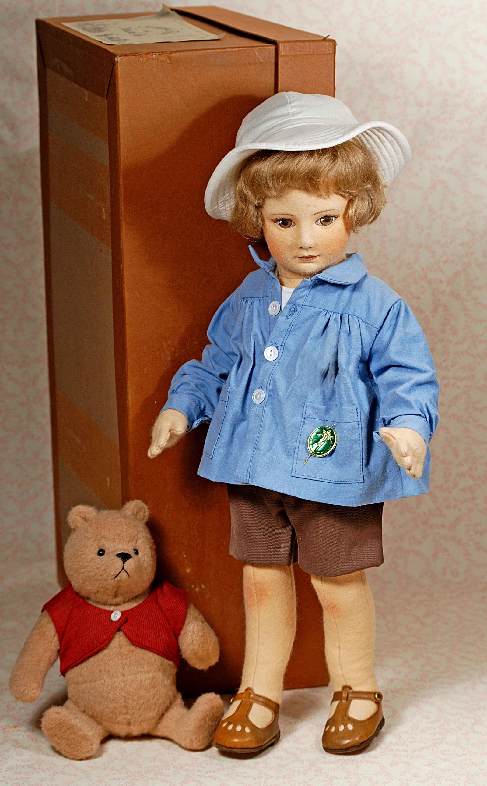 R. JOHN WRIGHT "CHRISTOPHER ROBIN AND WINNIE THE POOH": R. JOHN WRIGHT "CHRISTOPHER ROBIN AND WINNIE THE POOH". 18". pressed felt character face with painted brown eyes, closed mouth, short brown bobbed mohair wig ,jointed shoulders and hips, wears a blue