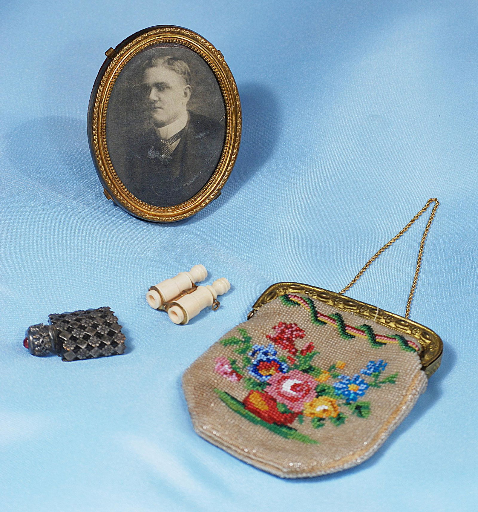 DOLL ACCESSORY ITEMS.: DOLL ACCESSORY ITEMS. Includes: Miniature bone opera glasses, perfume flask, Victorian era photo in gilt frame, 4" beaded purse with embossed metal frame.