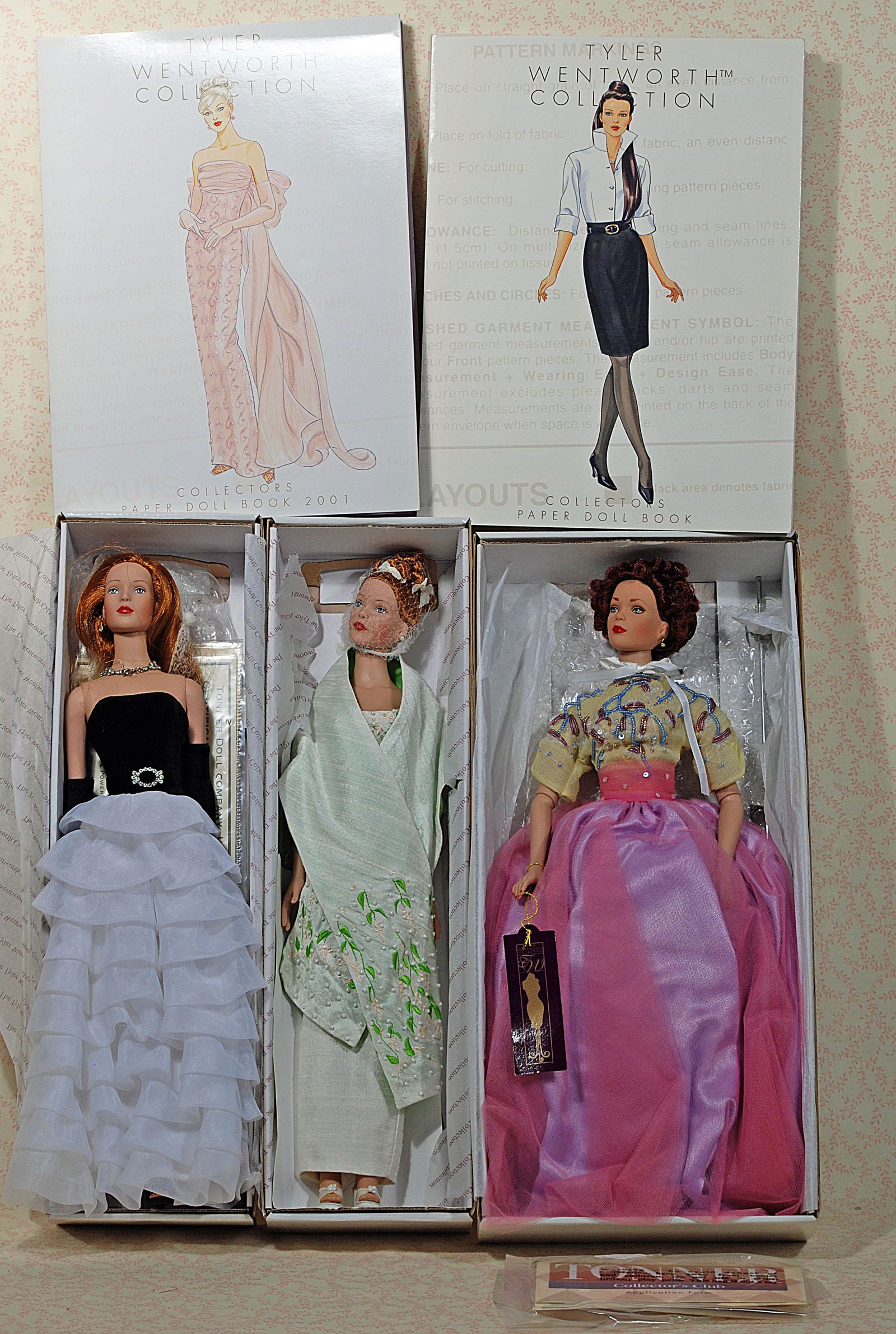 THREE ROBERT TONNER TYLER WENTWORTH DOLLS & TWO PAPER: THREE ROBERT TONNER TYLER WENTWORTH DOLLS & TWO PAPER DOLLS. Includes: Something Sleek-red hair with A Kiss on The Hand outfit; Chicago Sophisticate exclusive for 2000 UFDC; Theatre De La Mode C’est