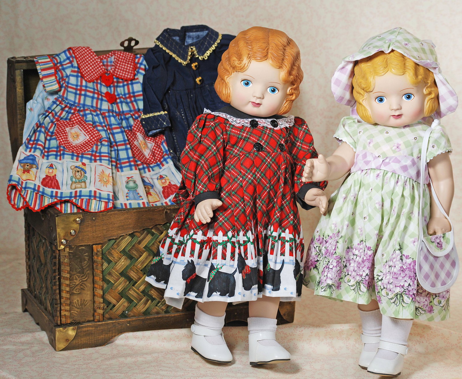 TWO DAISY KINDGOM DOLLS & EIGHT COSTUMES WITH TRUNK.: TWO DAISY KINDGOM DOLLS & EIGHT COSTUMES WITH TRUNK. 17" dolls with sculpted hair and painted features, original costumes; plus trunk with eight assorted costumes. Excellent condition.