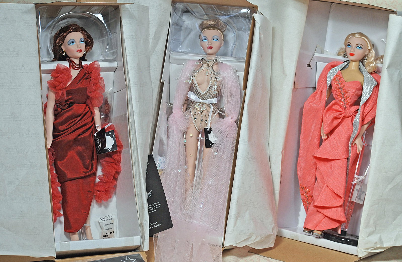 FOUR ASHTON-DRAKE GENE DOLLS DESIGNED BY MEL ODOM.: FOUR ASHTON-DRAKE GENE DOLLS DESIGNED BY MEL ODOM. Includes: Coral Kiss, Red Venus, and Bird of Paradise. All mint-in-box.