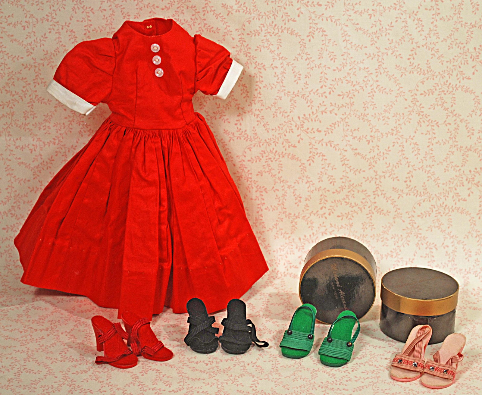 MADAME ALEXANDER TAGGED DRESS, TEEN DOLL OUTFIT, HAT: MADAME ALEXANDER TAGGED DRESS, TEEN DOLL OUTFIT, HAT BOXES AND SHOES. Includes: Two hat boxes, four pair of high heel shoes for Cissy, plus Elise tagged red cotton dress; red velvet jacket, skirt, coa