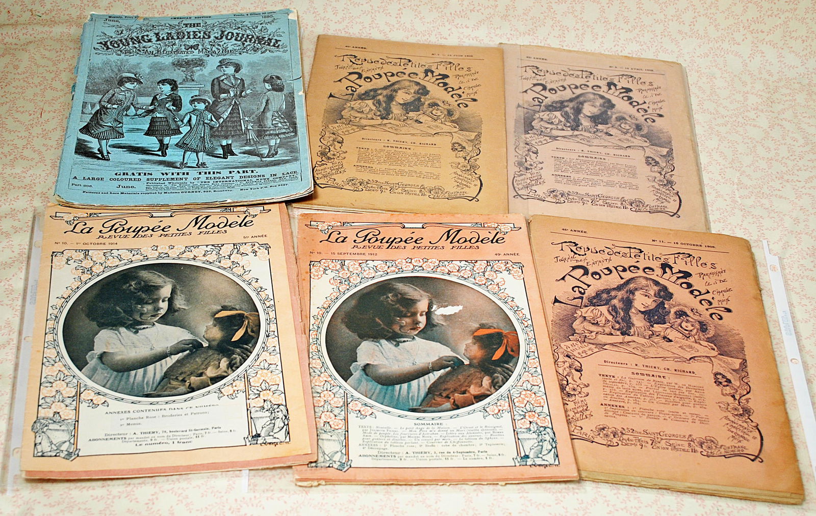 1900 ERA LA POUPEE MODELE JOURNALS & "YOUNG LADIES: 1900 ERA LA POUPEE MODELE JOURNALS & "YOUNG LADIES JOURNAL" MAGAZINE. La Poupee Modele issues 5, 7 and 11of 1908; issue No. 10 of 1912 and issue No. 10 of 1914 which include patterns. Plus June 1880 �
